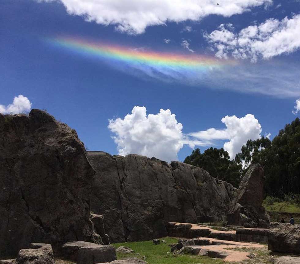 athena naia rainbowl over mountains peruvian ruins on a sunny day